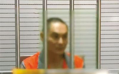 涉嫌窩藏罪的李明在接受訊問(wèn)。